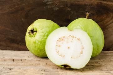 Fresh guava (tropical fruit) on wooden background