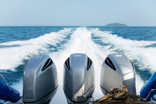 Three powerful engines mounted on the speedboat