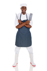 young african butcher holding knives