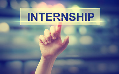 Internship concept with hand pressing a button