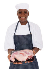 african american butcher holding raw meat