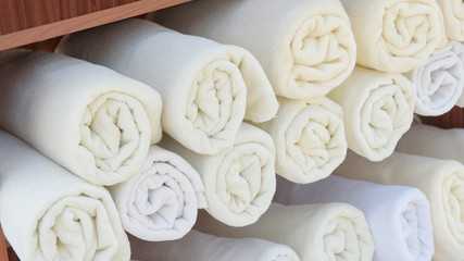 Rolled up white spa towels