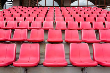 Fototapeta premium Red seats in football stadium