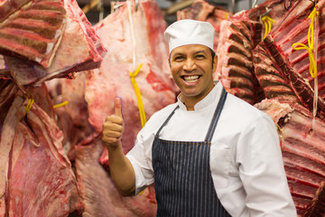 mature butchery owner thumb up