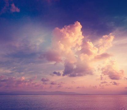 Fototapeta Sunset sky over the calm surface of the sea.