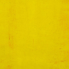 cement yellow wall with street, textured background