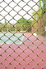 Fototapeta premium cage of blurred tennis court