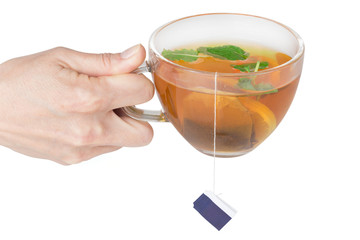 weibliche Hand haltet eine Tasse Tee