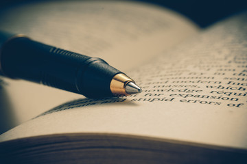 pen and book with filter effect retro vintage style