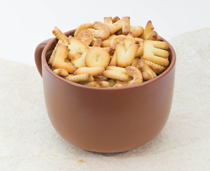 Lot of bread letters in a cup