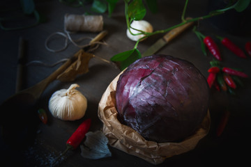 red cabbage on the table, garlic and red hot peppers on the table