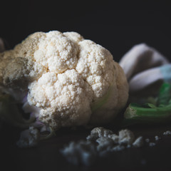 white cauliflower on the table, dark natural light