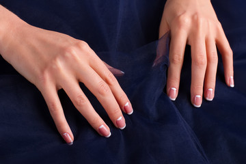 Trendy french manicure with blue tulle.