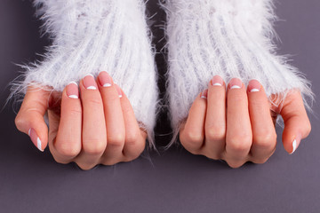 Sleeves of fluffy sweaters and french manicure. - 102721400
