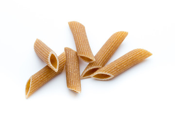 Rye flour macaroni pasta close up isolated on white.