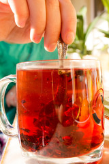 tea in a transparent mug with spices