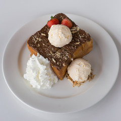 Fresh Toast with chocolate spread on a white plate with icescrea