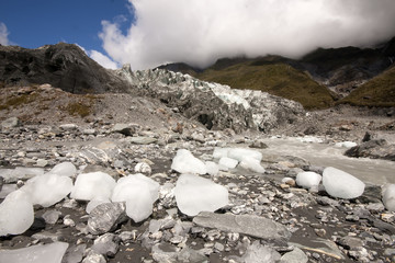 pieces of ice fall from the Fox Glacier, New Zealand, South Island