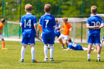 Obraz premium Children's Soccer Match. Kids Playing Soccer Game.