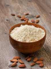 Obraz na płótnie Canvas almond flour in a wooden bowl