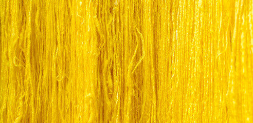 Yellow raw silk thread background