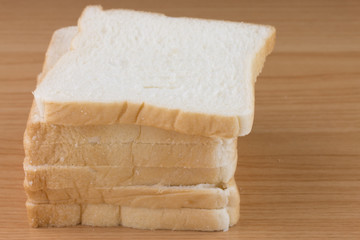 Whole wheat bread on wooden table.