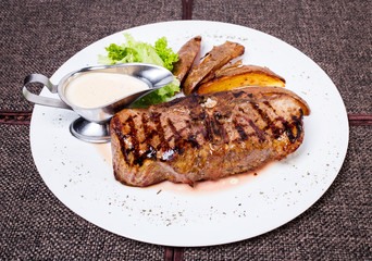 Delicious beef steak with roasted potatoes.