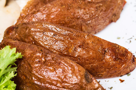 Roast potatoes as a garnish for beef steak.