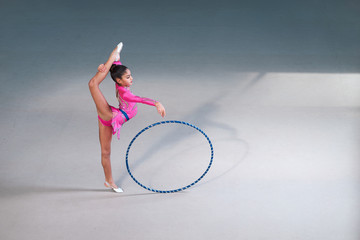 gymnast in a beautiful  suit doing hoop exercise © Аrtranq