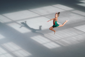 girl jumping gymnast trains in sports school