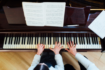 Fototapeta na wymiar piano lessons at a music school, teacher and student