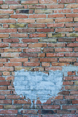 Old brick wall with a white stain useful for copyspace