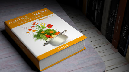 Hardcover book on Healthy Cooking with illustration on cover, on wooden surface.