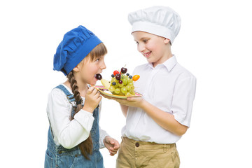 Children holding hedgehog shape fruit snack