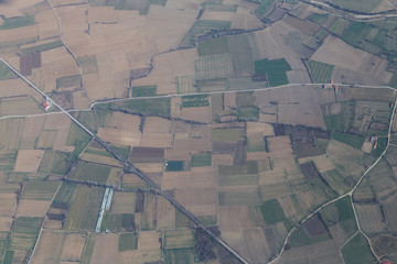 Landscape with green farmland patches, aerial shot.
