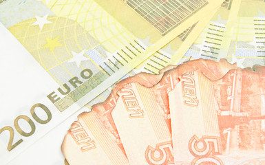 burnt russian banknotes and euros background
