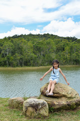 Little Asian girl portrait with landscape.
