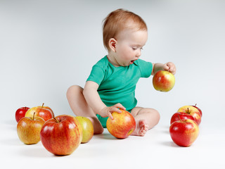 Fototapeta na wymiar Adorable child with apples