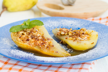 Pear baked with honey, curd cheese and walnut
