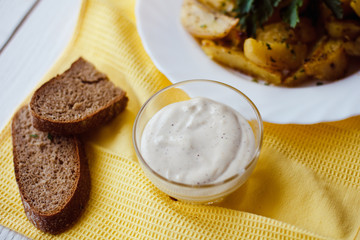 beautiful roasted potatoes with herbs and spices on a white plate