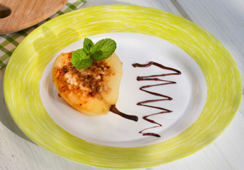 Pear baked with honey, curd cheese and walnut