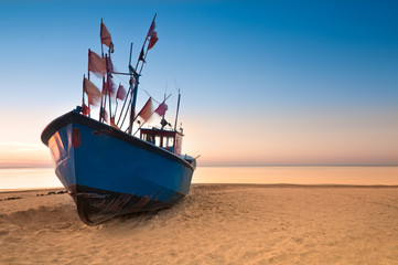 Fototapeta premium Old fishing boat on the Baltic Sea coast