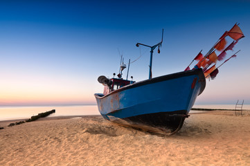 Naklejka na ściany i meble Old fishing boat on the Baltic Sea coast