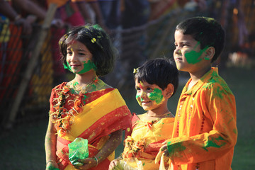 Children are enjoying Holi, the color festival of India.   The festival of color at Shantiniketan, the abode of Rabindranath Tagore.