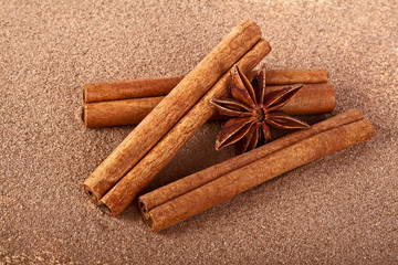 Star anise, cinnamon sticks with powder isolated on white backgr