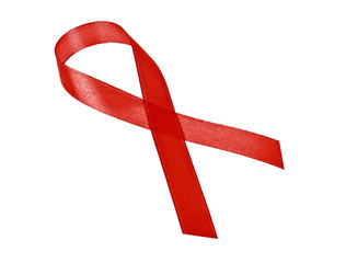 Aids awareness red ribbon isolated on white background