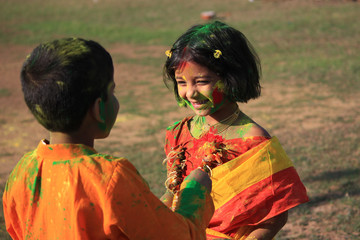 Children are enjoying Holi, the color festival of India.   The festival of color at Shantiniketan, the abode of Rabindranath Tagore.