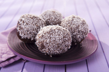 sweet and delicious chocolate balls with coconut flakes 