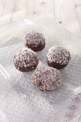 sweet and delicious chocolate balls with coconut flakes 