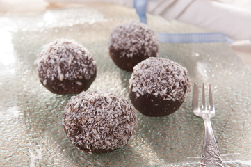 sweet and delicious chocolate balls with coconut flakes 